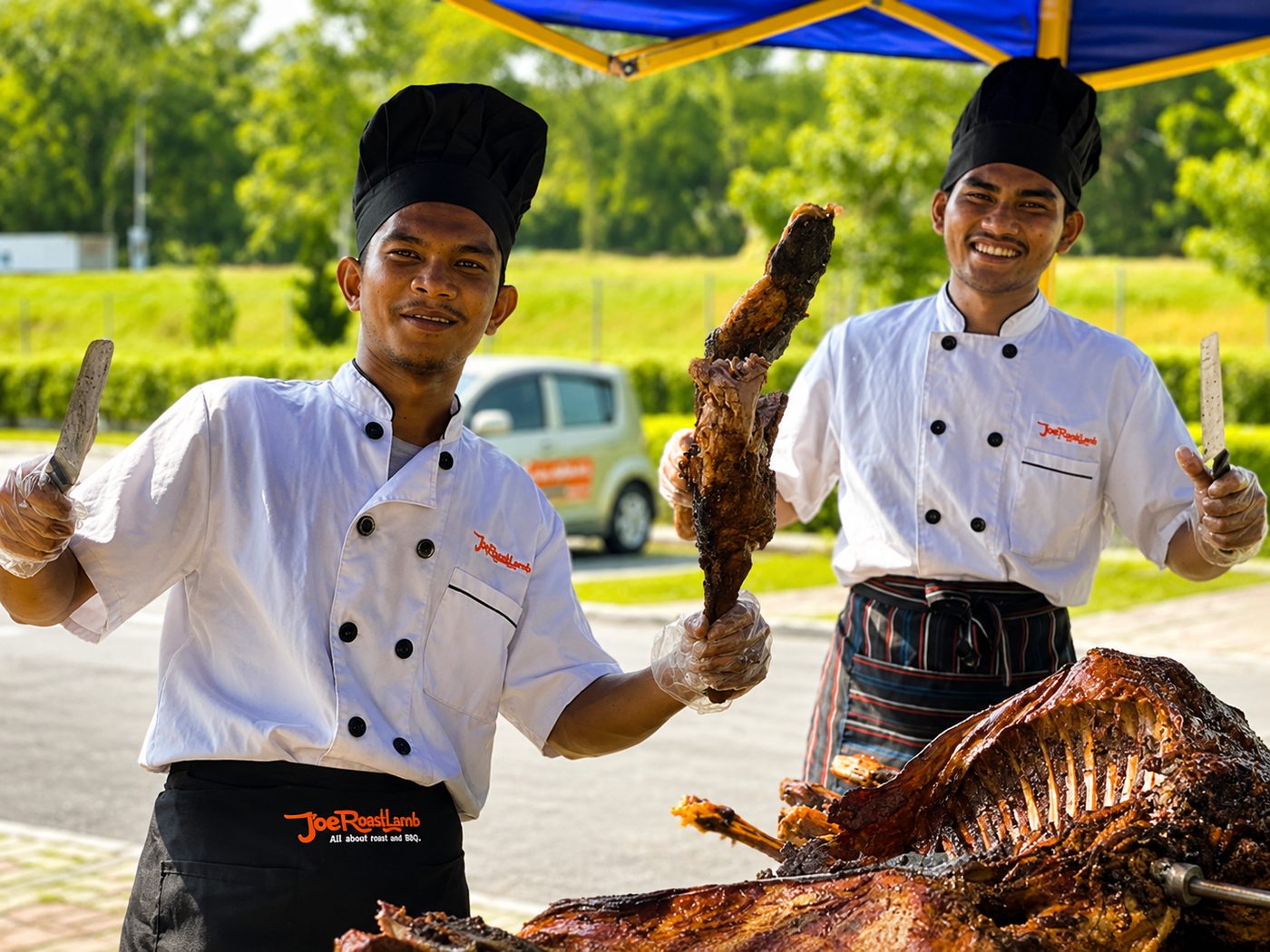 Joe Roast Lamb chefs in branded uniforms ready to serve at a live roast event